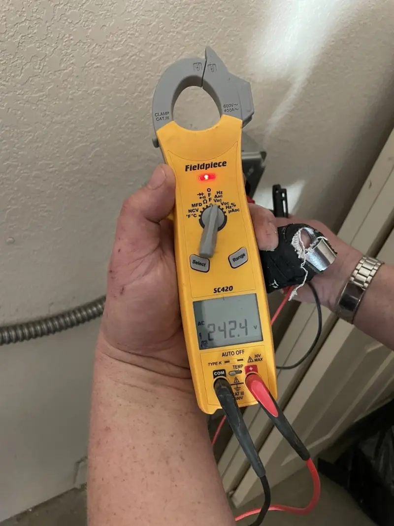 Voltage testing with clamp meter during Electrical Installation Services in Daytona Beach